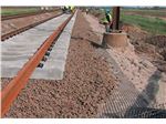 Road and railway base reinforcement using Geogrids and Geotextiles