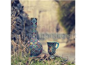 Cup and glass ceramic or enamel designs on pottery relief