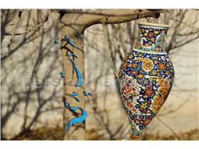 Hanging pot with a height of 40 cm of clay with enamel designs on pottery