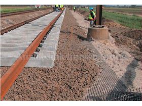 Road and railway base reinforcement using Geogrids and Geotextiles